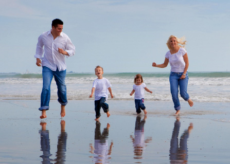 Family on a beach heaving fun.